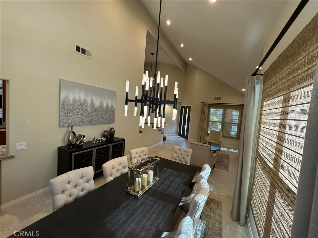 6 Lakeridge Rancho Santa Margarita, CA 92679 - Photo 31 of 75 a living room with furniture and a chandelier