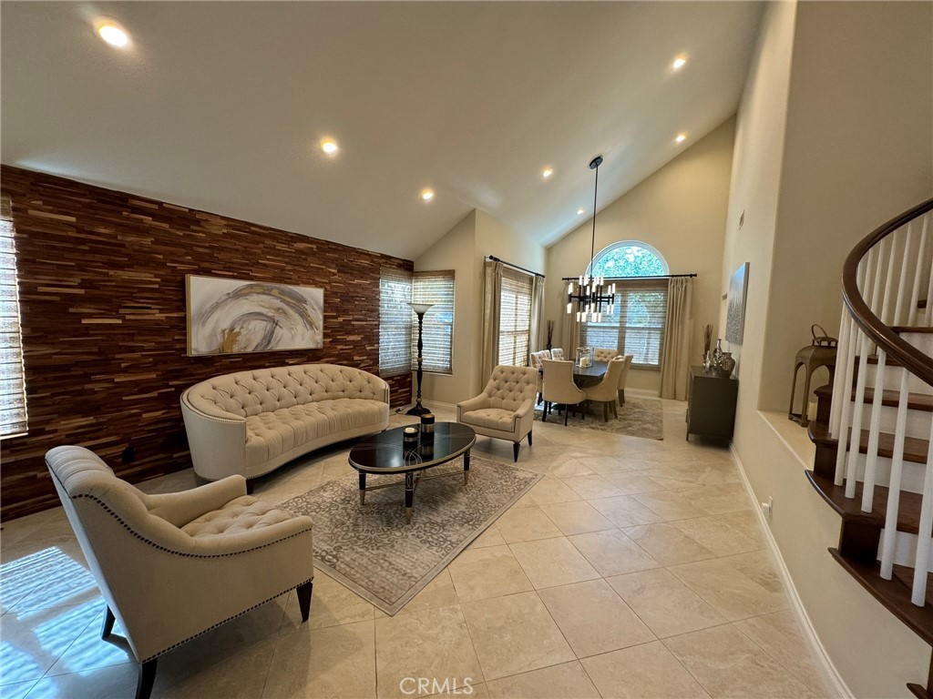 6 Lakeridge Rancho Santa Margarita, CA 92679 - Photo 33 of 75 a living room with furniture and a flat screen tv