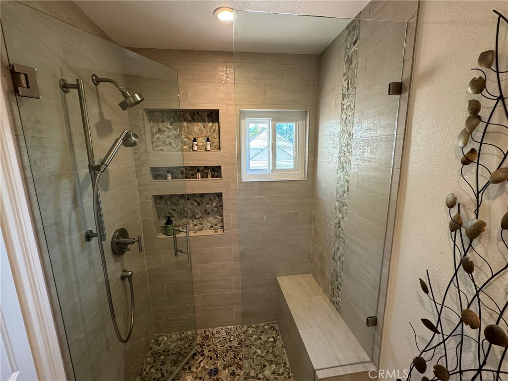 6 Lakeridge Rancho Santa Margarita, CA 92679 - Photo 52 of 75 a bathroom with a shower and a sink