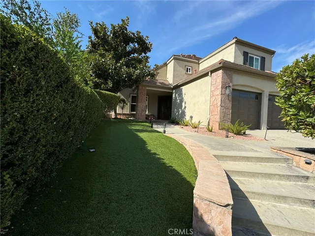 a view of a backyard with wooden fence