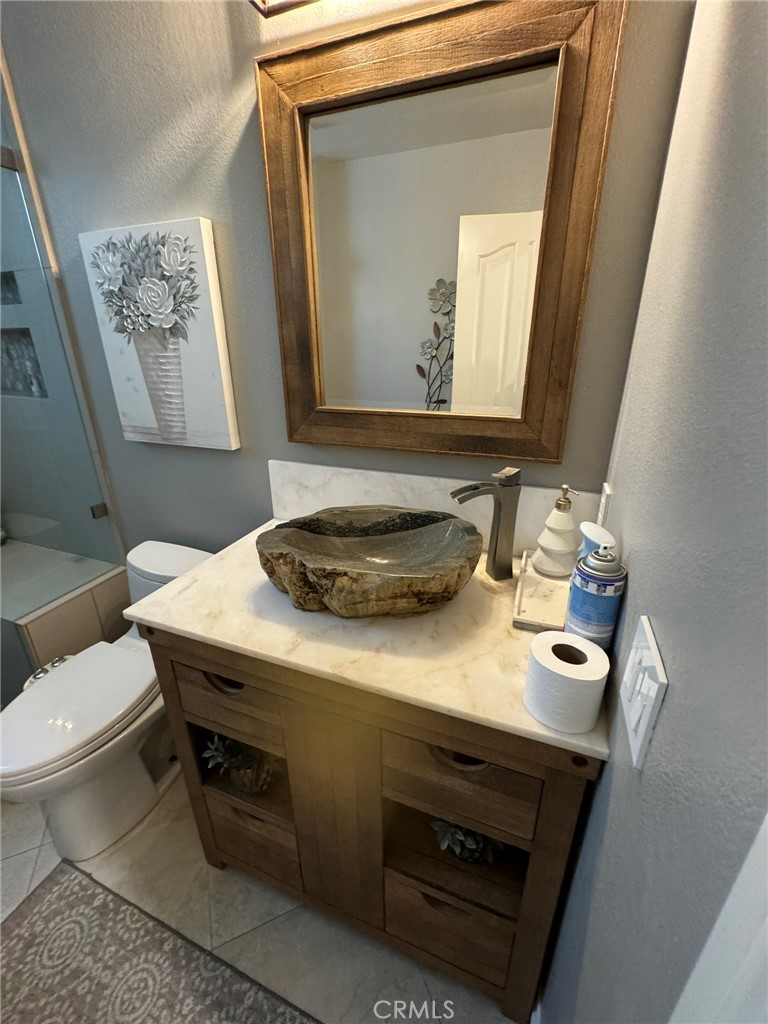 6 Lakeridge Rancho Santa Margarita, CA 92679 - Photo 64 of 75 a bathroom with a granite countertop sink and a mirror