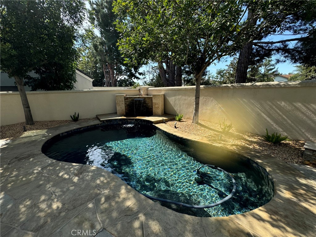 6 Lakeridge Rancho Santa Margarita, CA 92679 - Photo 9 of 75 a view of a backyard with wooden fence