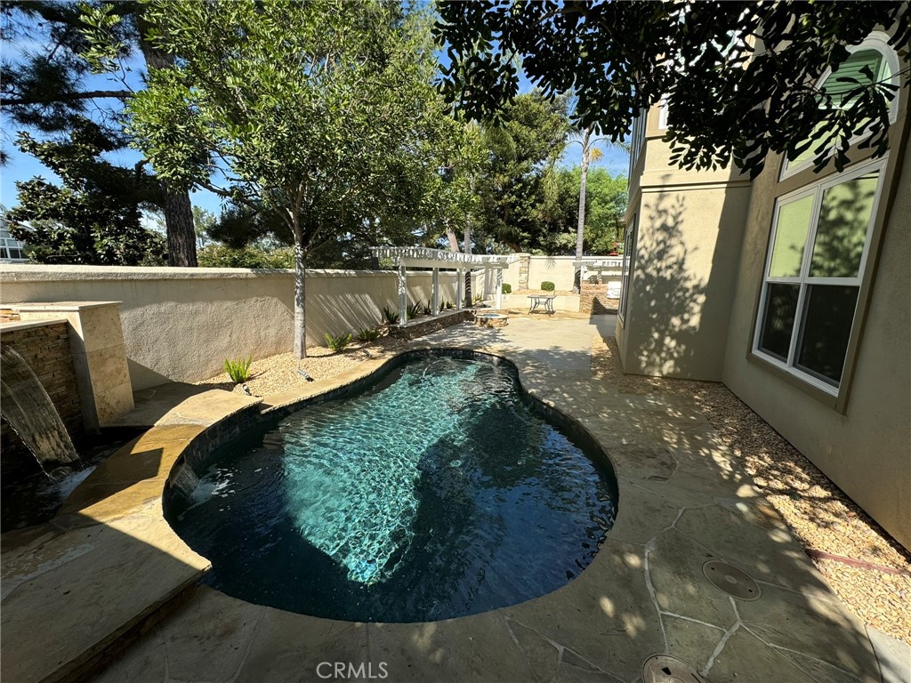 6 Lakeridge Rancho Santa Margarita, CA 92679 - Photo 10 of 75 a view of a swimming pool with a yard