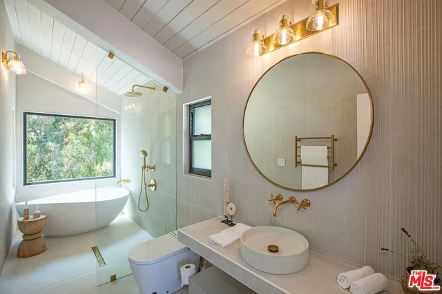 a bathroom with a toilet and a sink