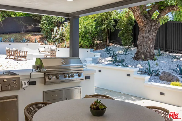 a kitchen with a stove and a sink