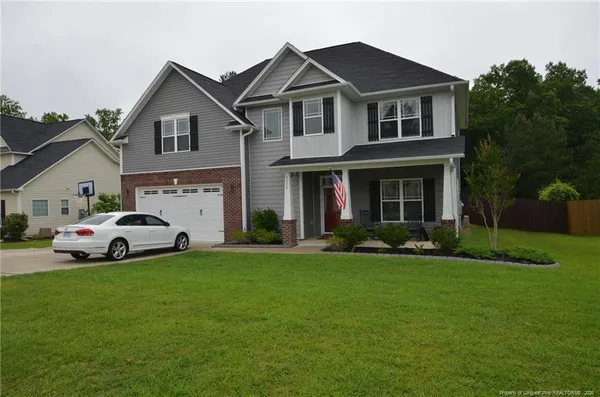 a big house with a big yard and more windows