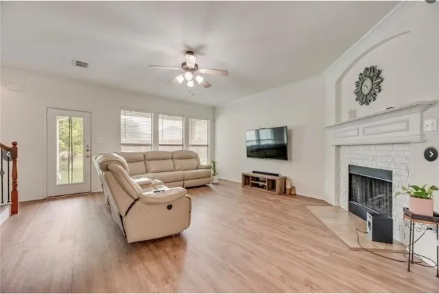 a living room with furniture and a fireplace