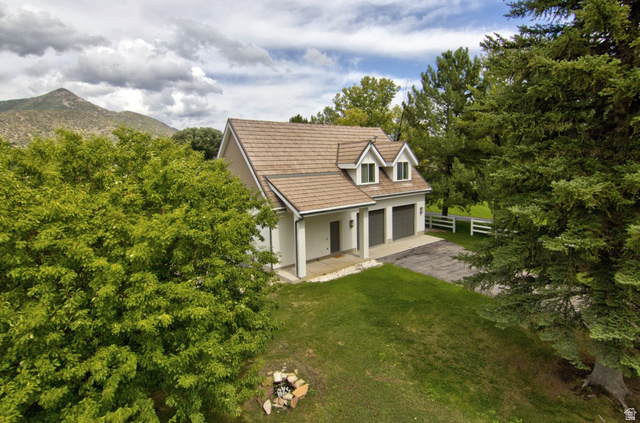 180 Farm Road Midway, UT 84049 - Photo 14 of 99 Two-story residence with a light-colored exterior, an attached two-car garage, and a brown shingle roof
