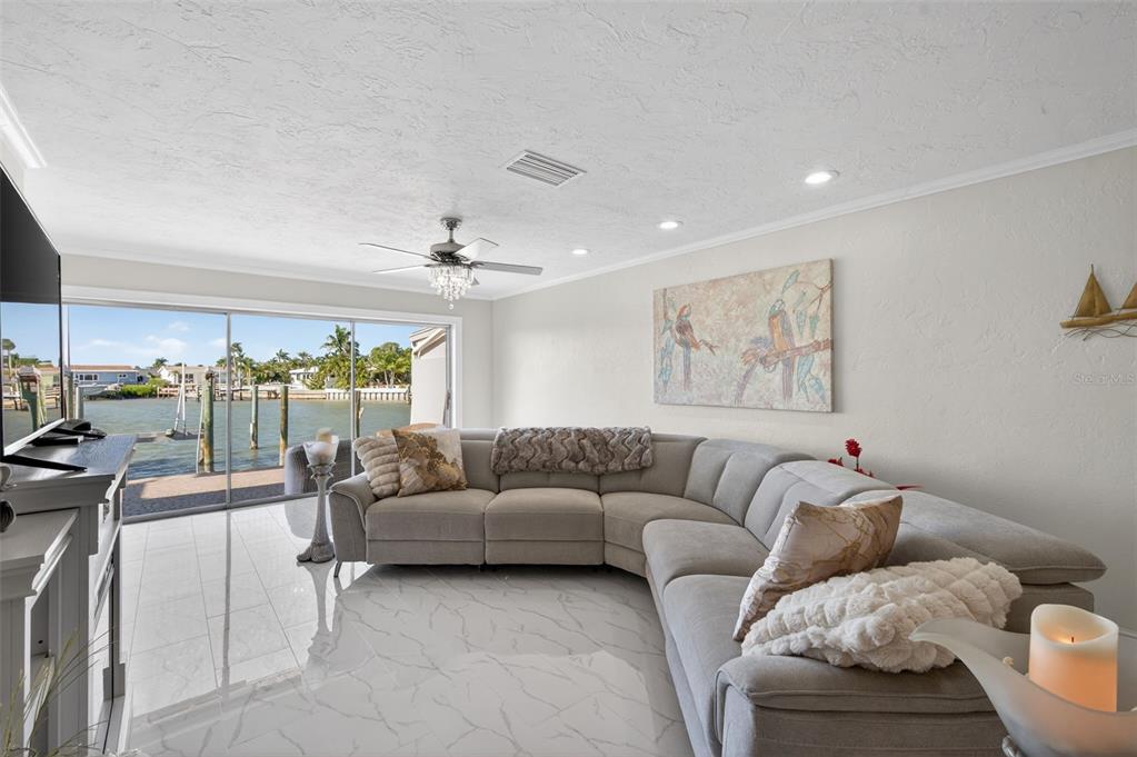 427 Boca Ciega Point Boulevard North St. Petersburg, FL 33708 - Photo 23 of 69 a living room with furniture and a large window
