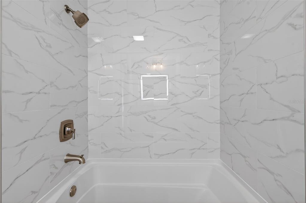 427 Boca Ciega Point Boulevard North St. Petersburg, FL 33708 - Photo 34 of 69 a bathroom with a bathtub