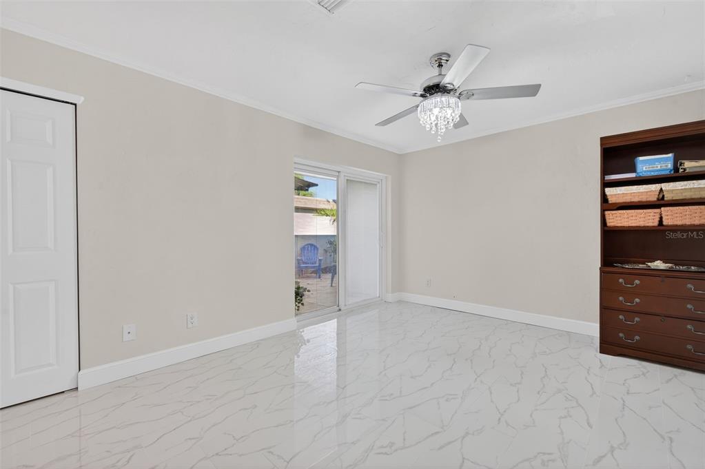 427 Boca Ciega Point Boulevard North St. Petersburg, FL 33708 - Photo 35 of 69 an empty room with closet and fan