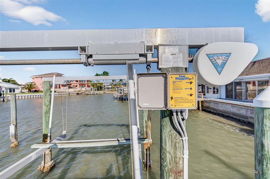 427 Boca Ciega Point Boulevard North St. Petersburg, FL 33708 - Photo 51 of 69 a water heater sitting next to a bathroom sink