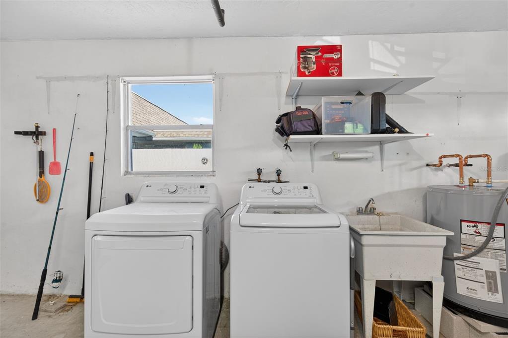 427 Boca Ciega Point Boulevard North St. Petersburg, FL 33708 - Photo 63 of 69 a utility room with dryer and washer