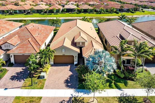 a view of a house with garden and lake view