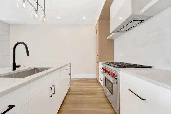 a kitchen with a stove and a sink
