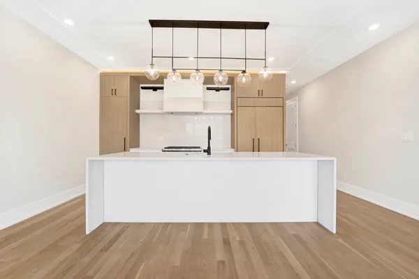 a room with wooden floor and table