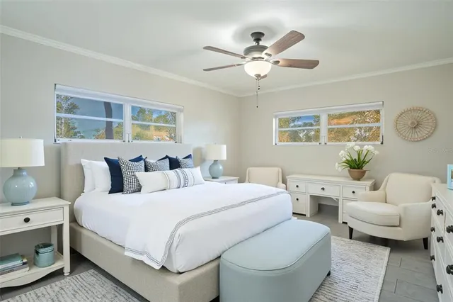 a spacious bedroom with a bed and a window