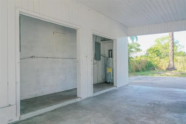 a view of a room with a porch and refrigerator