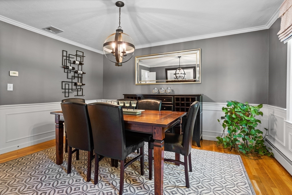 4 Fox Lane Westborough, MA 01581 - Photo 13 of 37 a view of a dining room with furniture and a chandelier