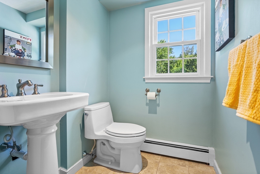 4 Fox Lane Westborough, MA 01581 - Photo 18 of 37 a bathroom with a toilet a sink and a window