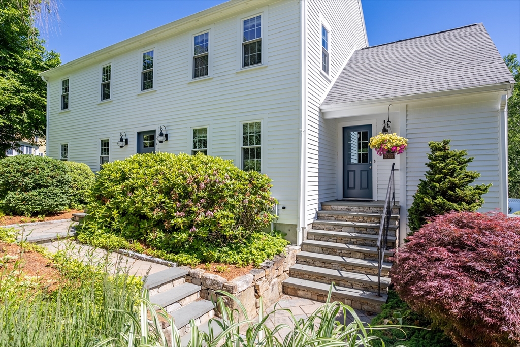 4 Fox Lane Westborough, MA 01581 - Photo 2 of 37 a front view of a house with plants