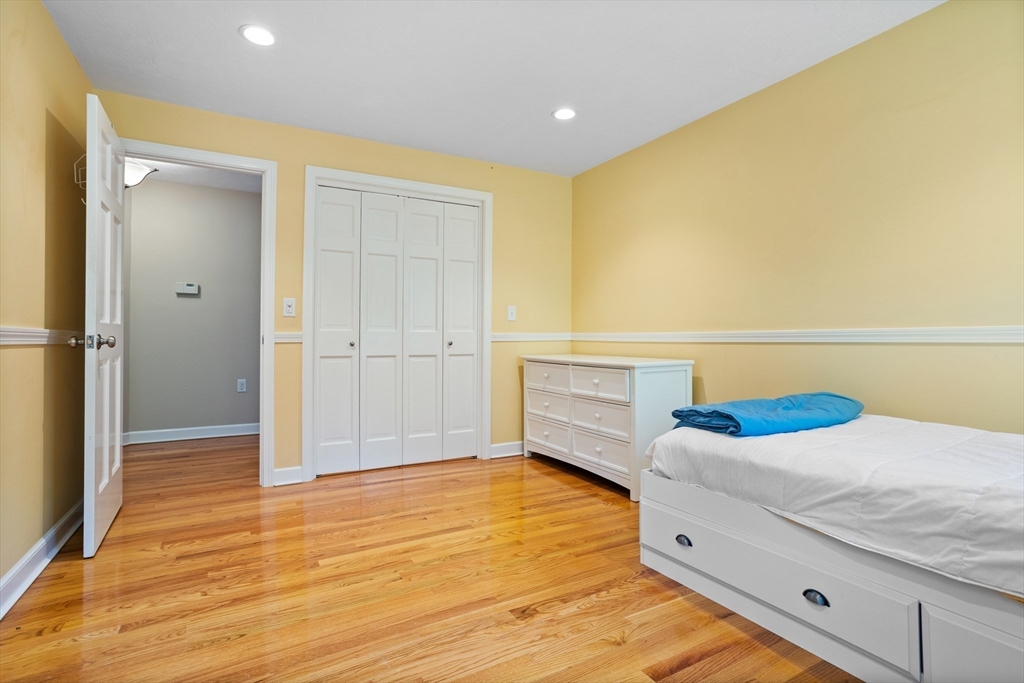 4 Fox Lane Westborough, MA 01581 - Photo 24 of 37 a bedroom with a bed and a cabinets