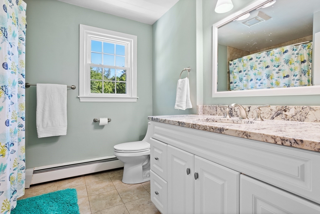 4 Fox Lane Westborough, MA 01581 - Photo 27 of 37 a bathroom with a granite countertop toilet sink and mirror