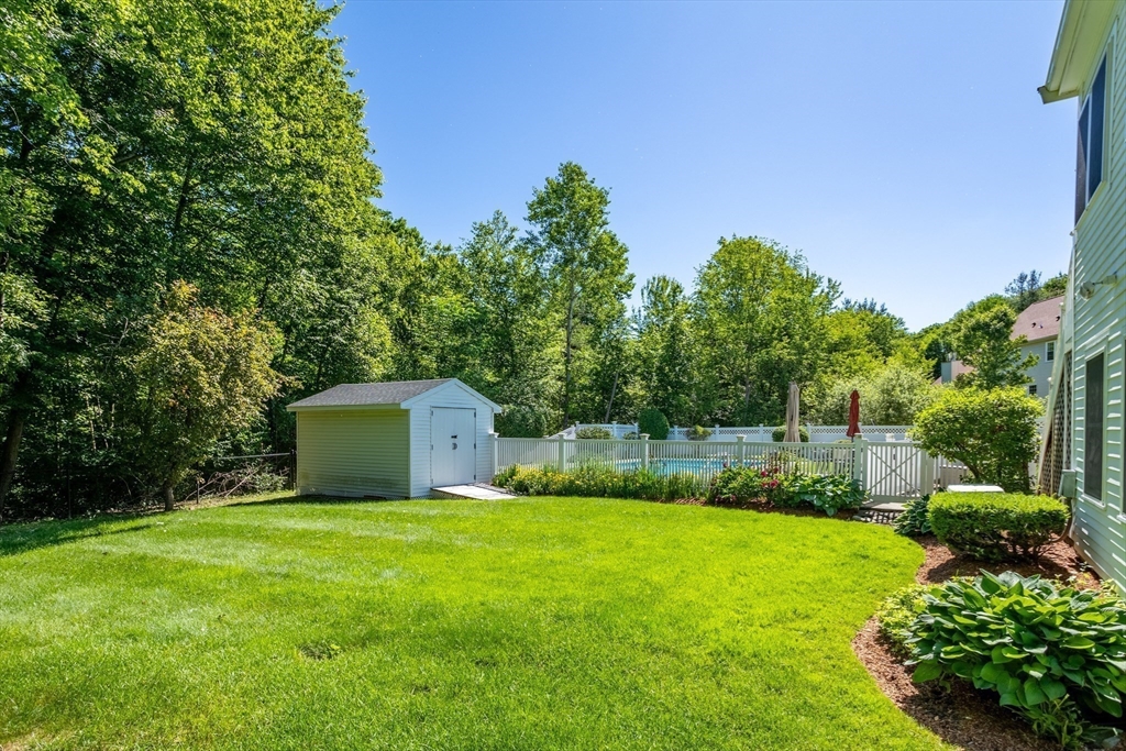 4 Fox Lane Westborough, MA 01581 - Photo 34 of 37 a view of a backyard with a garden