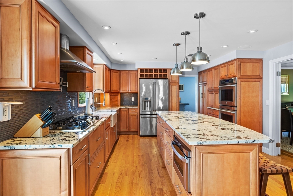 4 Fox Lane Westborough, MA 01581 - Photo 4 of 37 a kitchen with stainless steel appliances granite countertop sink stove and refrigerator