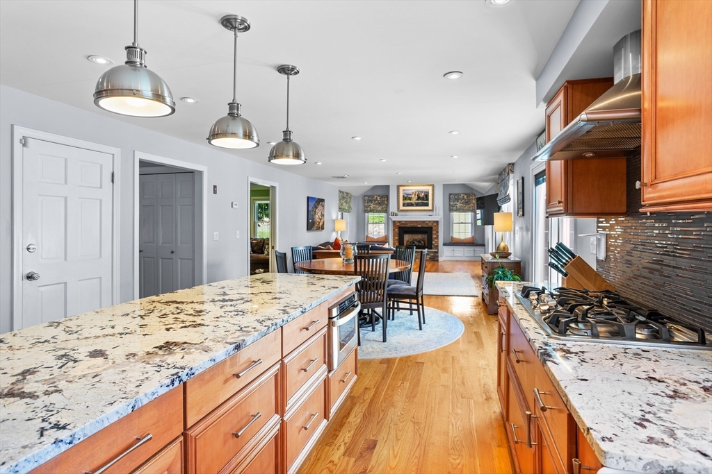 4 Fox Lane Westborough, MA 01581 - Photo 6 of 37 a open kitchen with stainless steel appliances granite countertop a stove and refrigerator a oven with wooden floors
