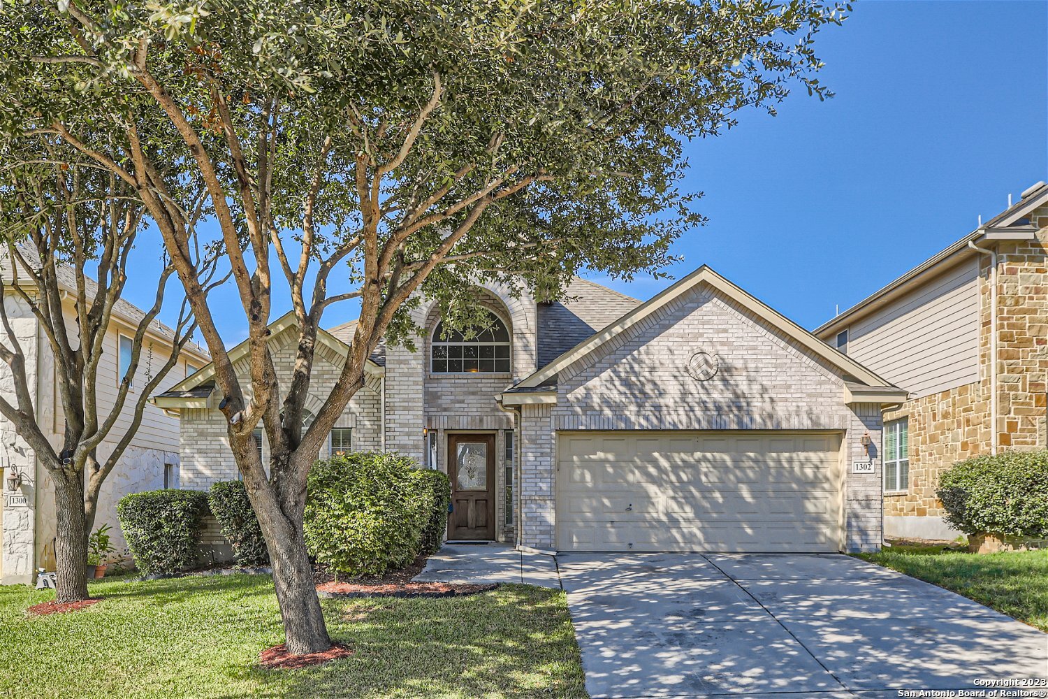 front view of a house with a yard