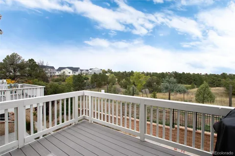 a view of balcony with yard