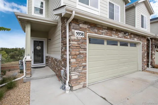 a view of a house with a door and a outdoor space