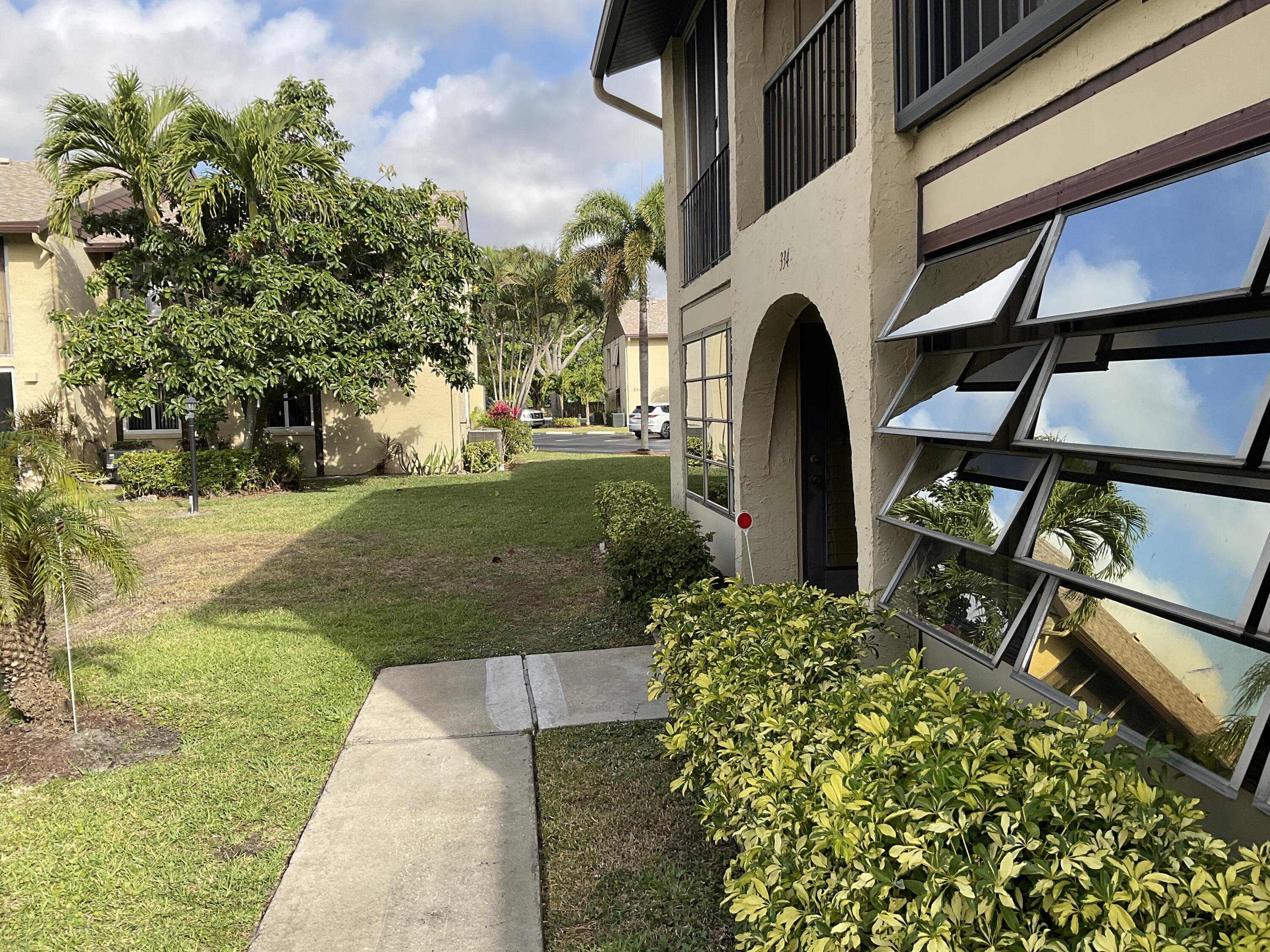 334 Pine Ridge Circle, Unit C1 Greenacres, FL 33463 - Photo 3 of 17 exterior front