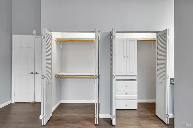 a bathroom with a granite countertop sink mirror and double