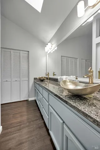 a bathroom with a toilet a sink and a shower