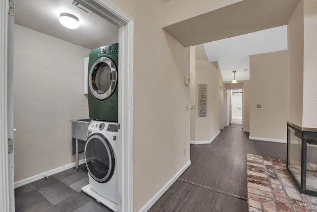 a view of a hallway with washer and dryer