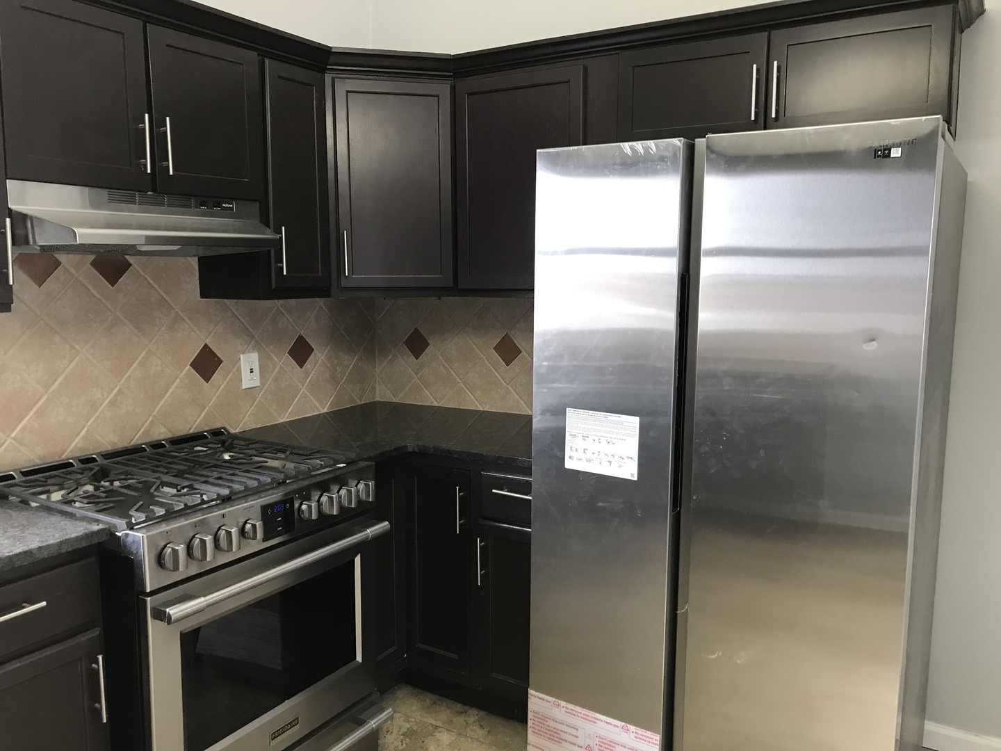 1994 Houghtby Road Shabbona, IL 60550 - Photo 2 of 45 a kitchen with stainless steel appliances granite countertop a refrigerator and a stove