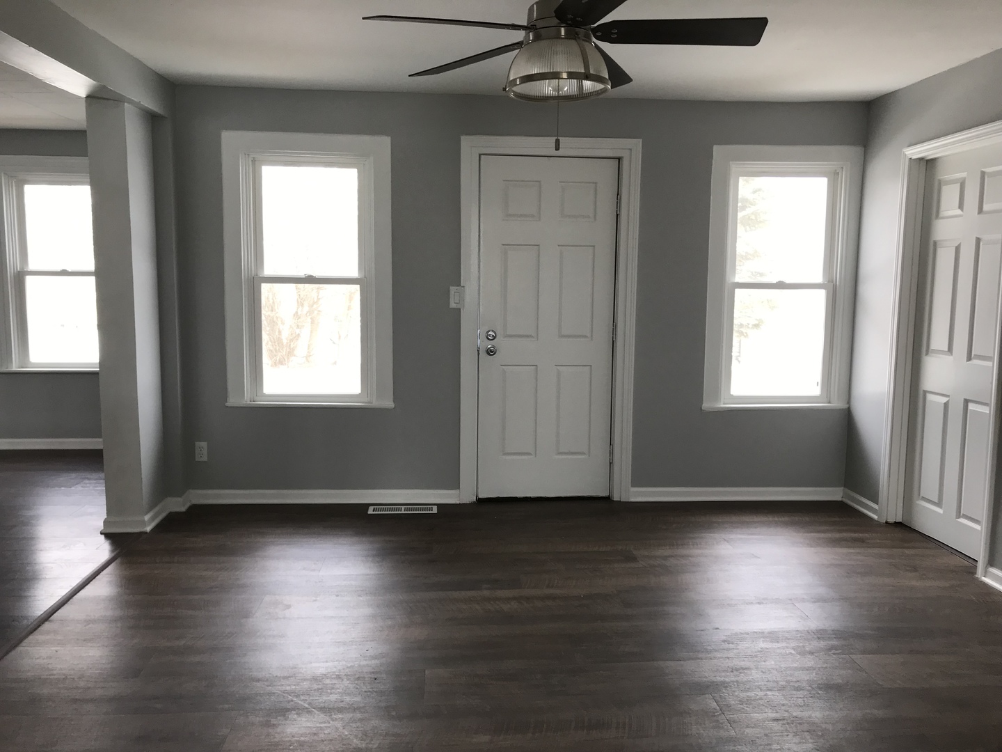 1994 Houghtby Road Shabbona, IL 60550 - Photo 6 of 45 a view of an empty room with wooden floor and a window