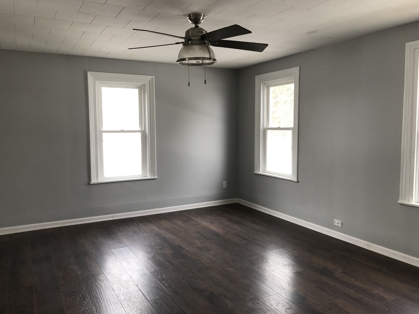 1994 Houghtby Road Shabbona, IL 60550 - Photo 7 of 45 a view of an empty room with wooden floor and a window