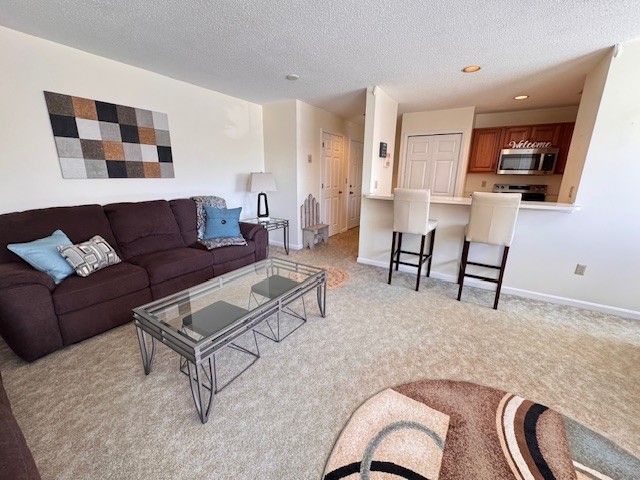 140 High Street, Unit 204 Westerly, RI 02891 - Photo 6 of 20 Open and bright living room.