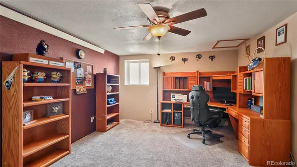 a view of a workspace with furniture
