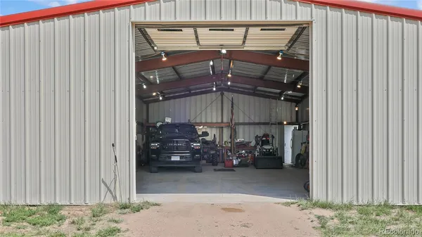 a view of a garage with an outdoor space