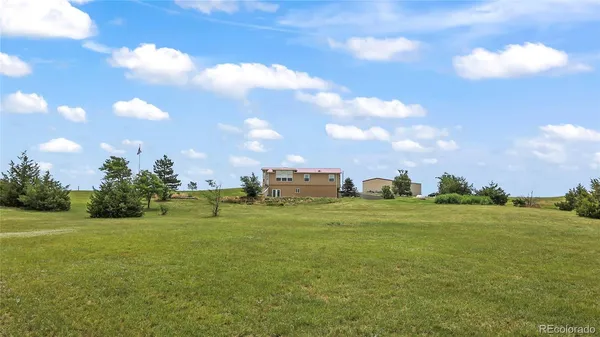 a view of a big building with big yard