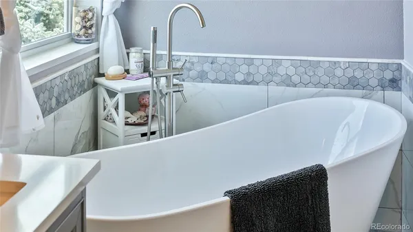 a view of a bath tub sitting in a bathroom