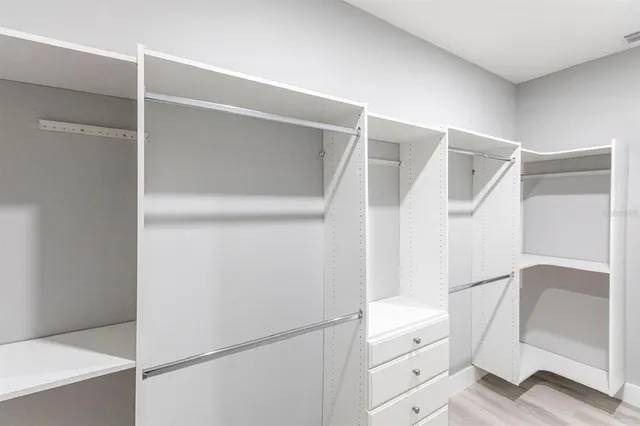 a view of an empty walk in closet
