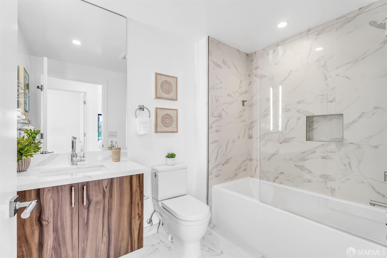 236 Shipley, Unit 405 San Francisco, CA 94107 - Photo 15 of 35 a bathroom with a bathtub shower sink and toilet