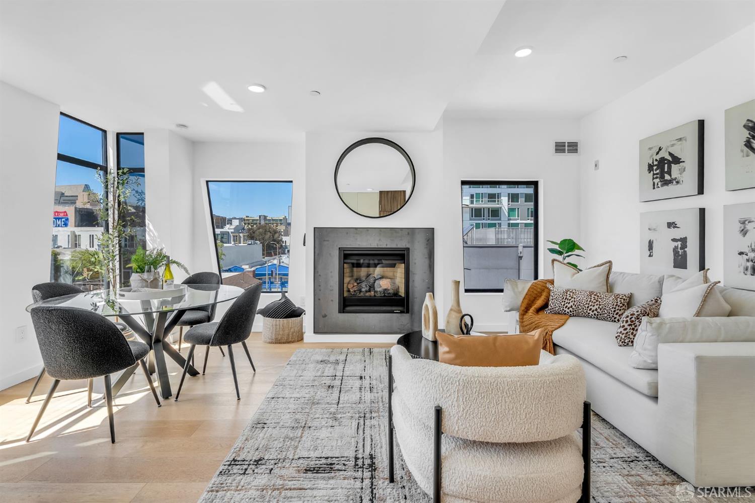 236 Shipley, Unit 405 San Francisco, CA 94107 - Photo 2 of 35 a living room with furniture a fireplace a rug and a large window