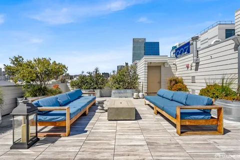 a terrace of a house with outdoor seating
