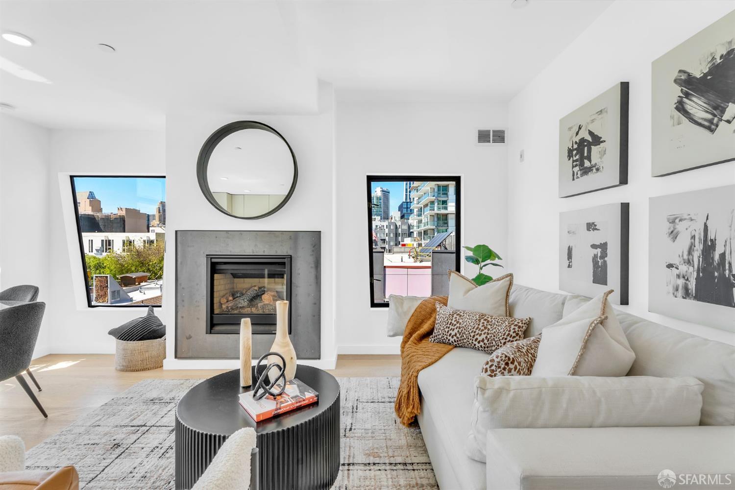 236 Shipley, Unit 405 San Francisco, CA 94107 - Photo 4 of 35 a living room with furniture and a fireplace